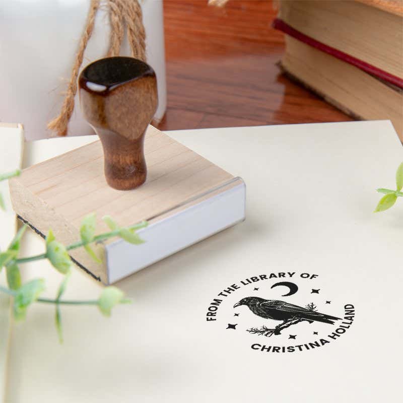 Custom book stamp on paper with wood handle stamp body