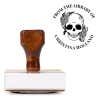 Front view of wood handle stamp body with library book stamp impression