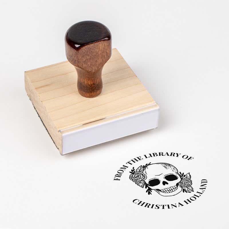 Wood handle stamp body with book stamp impression