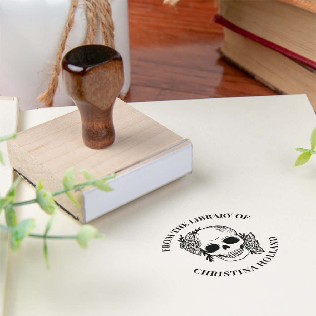 Custom book stamp on paper with wood handle stamp body