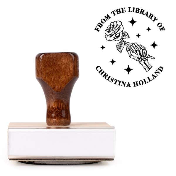 Front view of wood handle stamp body with library book stamp impression