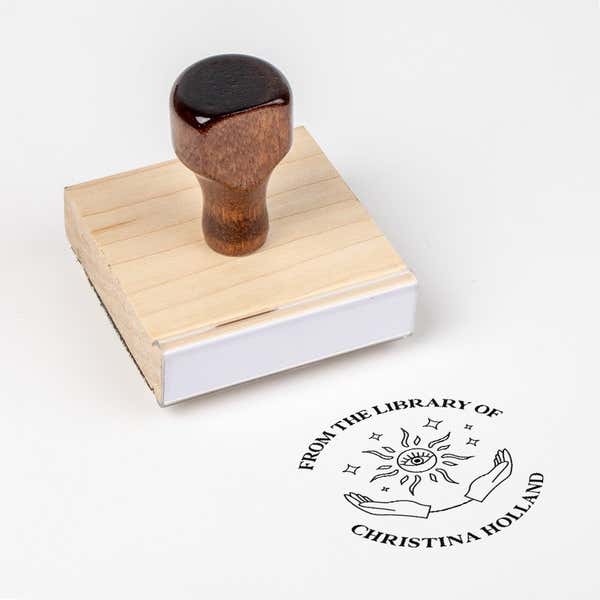 Wood handle stamp body with book stamp impression
