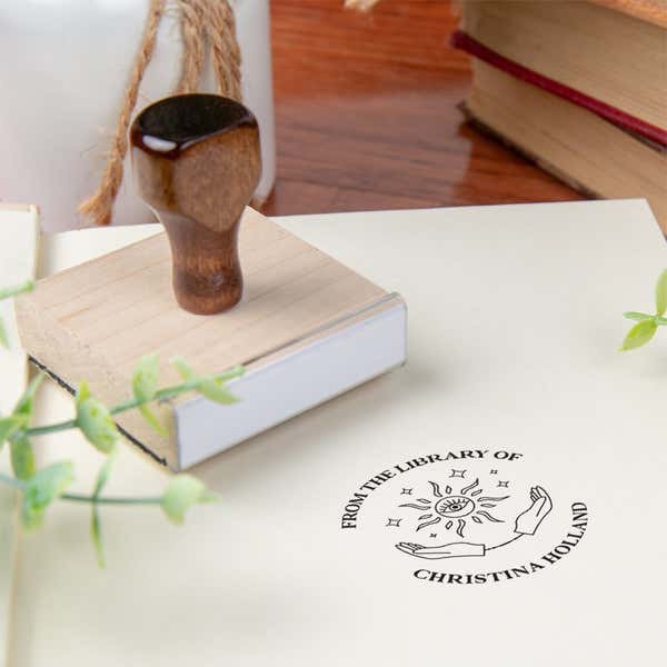 Custom book stamp on paper with wood handle stamp body