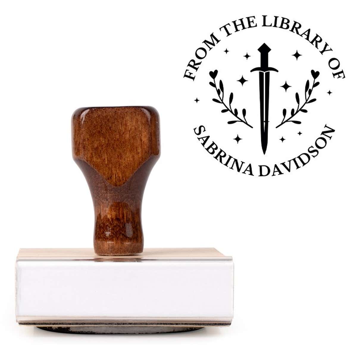 Front view of wood handle stamp body with library book stamp impression