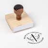 Wood handle stamp body with book stamp impression