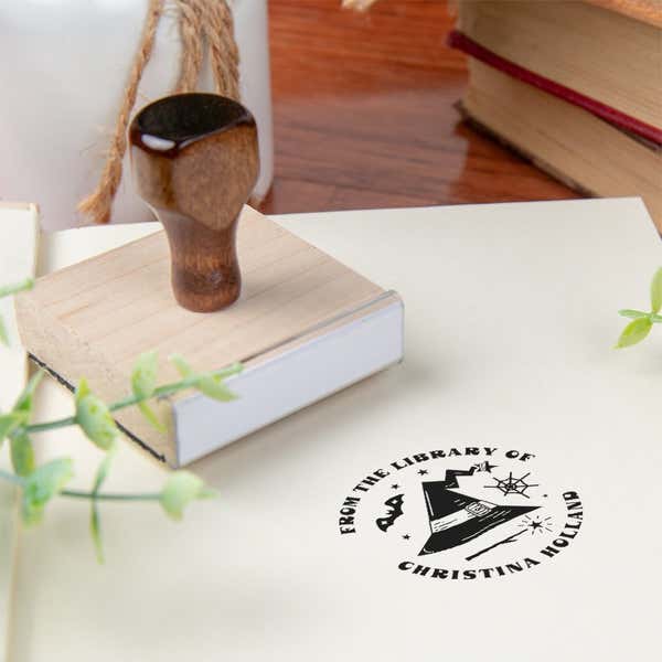 Custom book stamp on paper with wood handle stamp body
