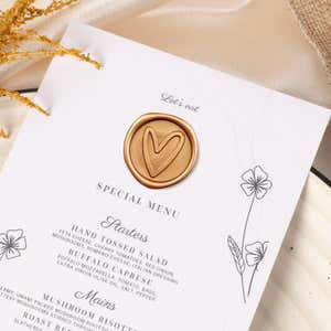 Gold Wax Seal Sticker, Heart Design Placed on a Wedding Menu