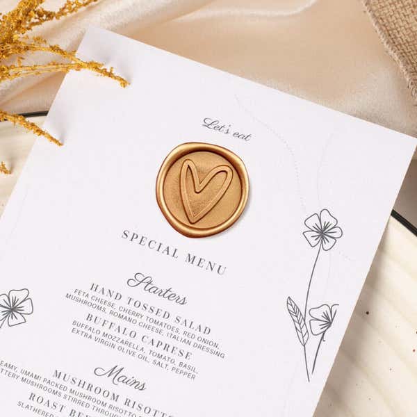Gold Wax Seal Sticker, Heart Design Placed on a Wedding Menu