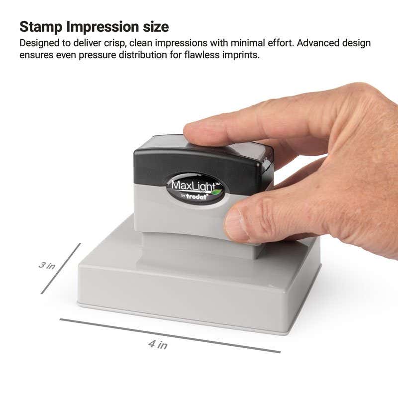 Hand pressing a MaxLight pre-inked stamp, with impression area measuring 3" x 4"