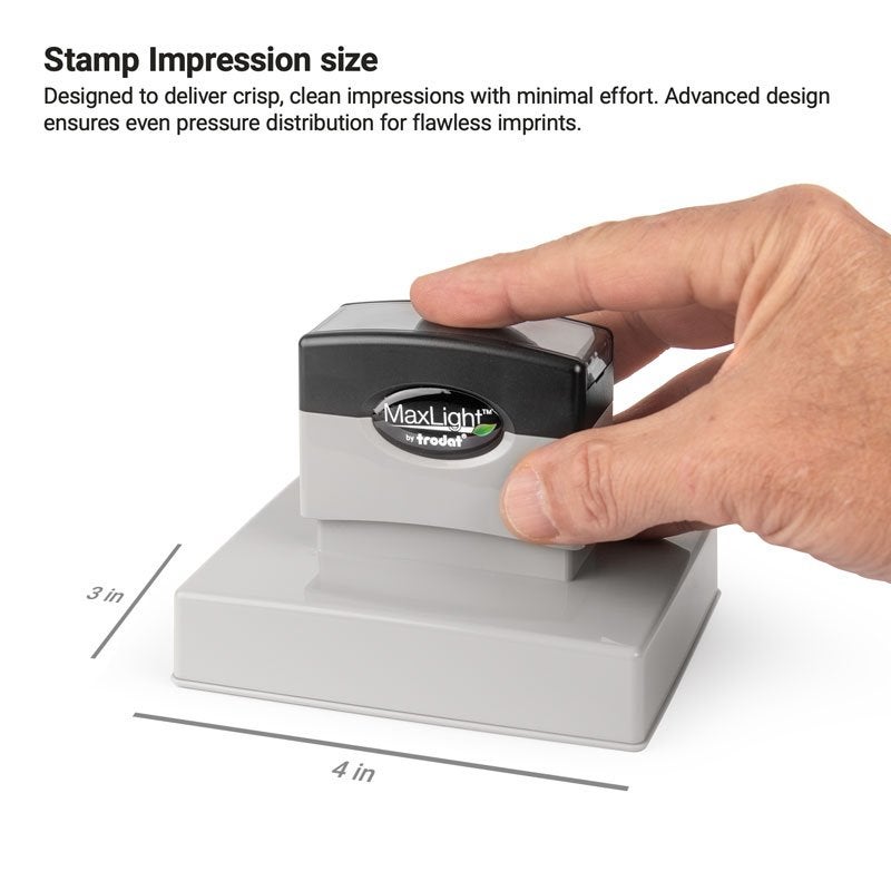 Hand pressing a MaxLight pre-inked stamp, with impression area measuring 3" x 4"