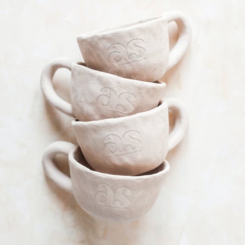 Stamped logo pressed into handmade pottery