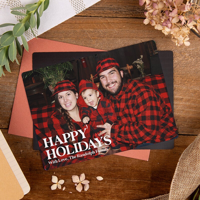 Magnetic holiday card displayed on a refrigerator