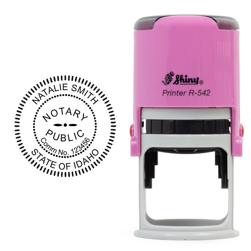 Pink Notary stamp and notary seal tools prepared for a signing appointment