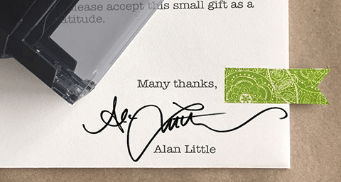 Signature stamp being used to sign checks and documents