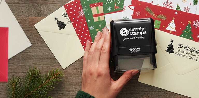 Personalized Christmas address stamp impression on a holiday envelope